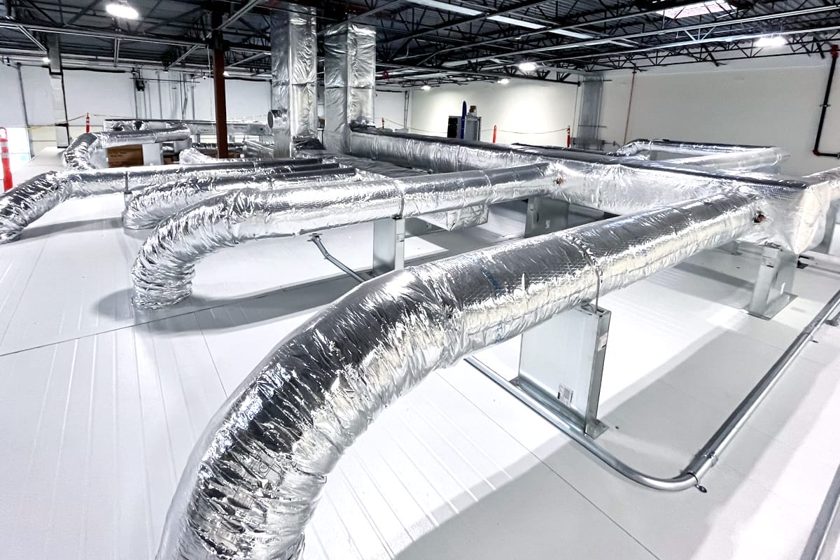 Photo of duct work on top of a modular cleanroom